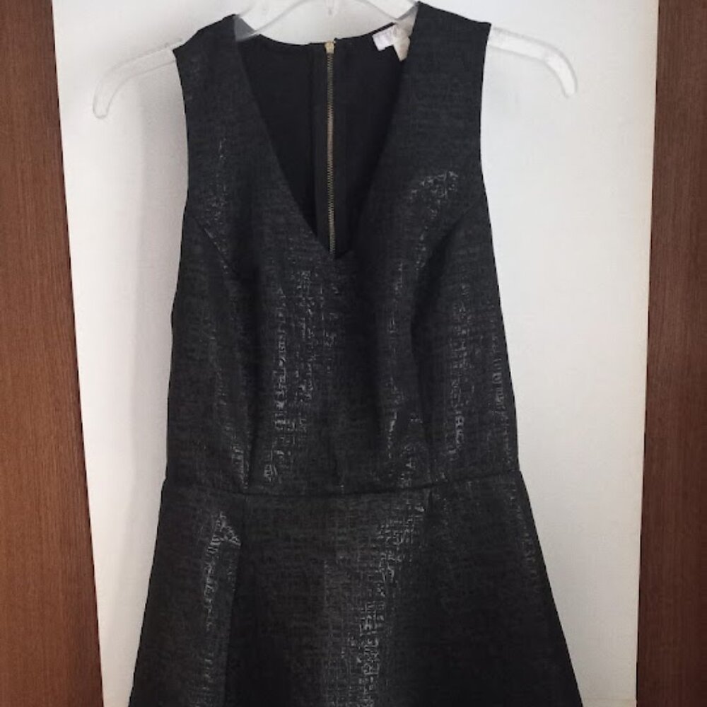 Medium black sleeveless dress with V neck.